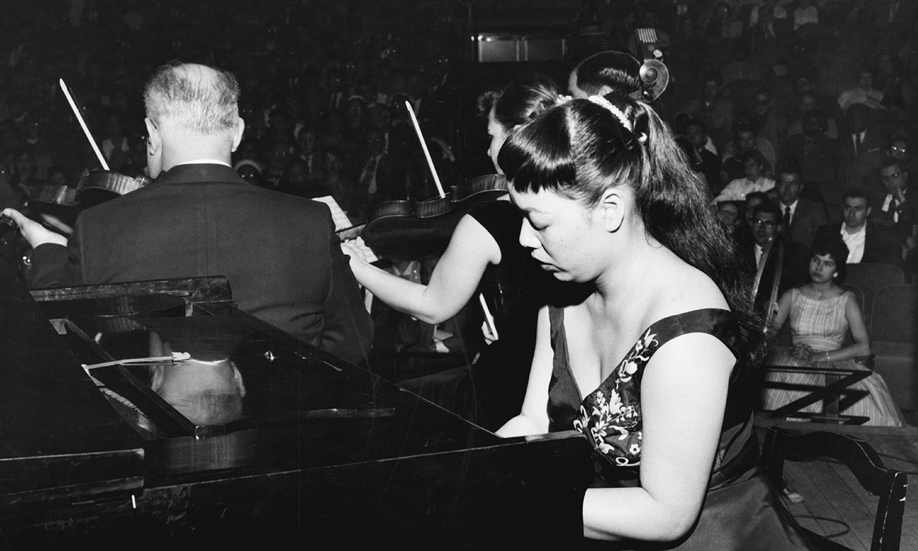 Toshiko Akiyoshi performing her Jazz Suite for Orchestra at a piano as a student in 1957