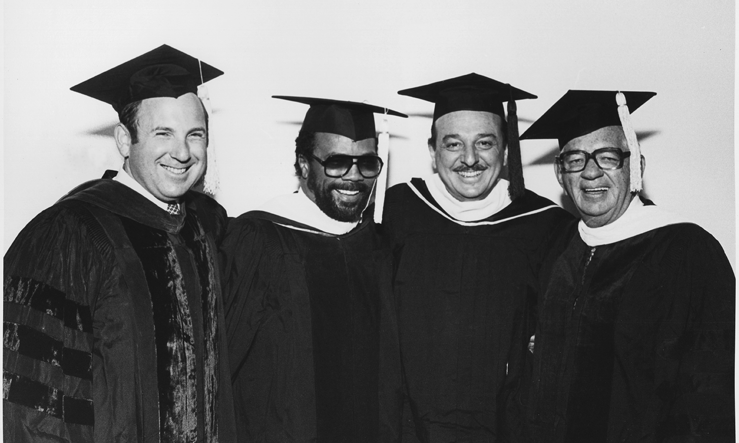 Berklee President Lee Eliot Berk, Quincy Jones, Arif Mardin, and Lawrence Berk at the 1983 commencement
