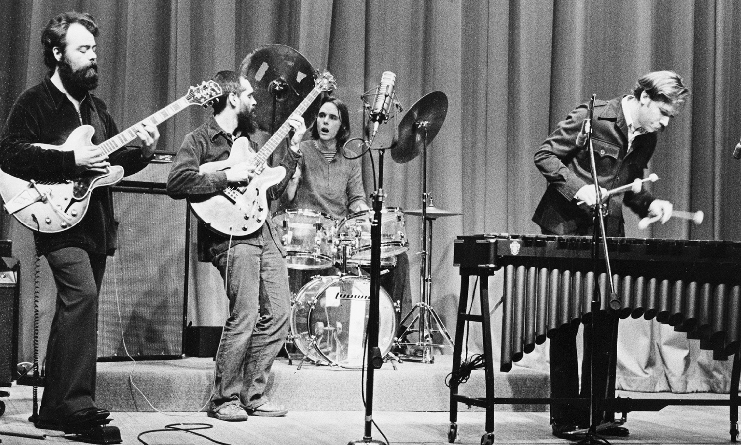 Photograph of a band performing on stage